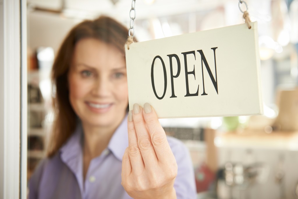 Woman Opening Local Store