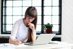 A Girl At Her Desk