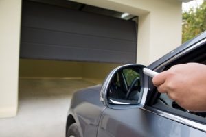 Man parking his car inside the garage