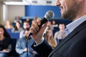 Male Guest Speaker in Front of Attendees