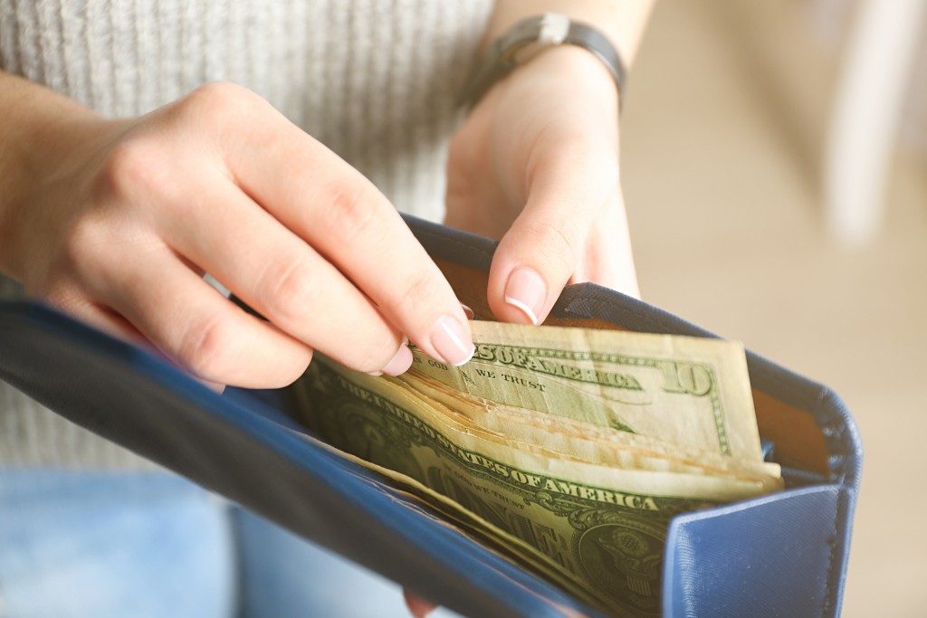 Woman counting her money