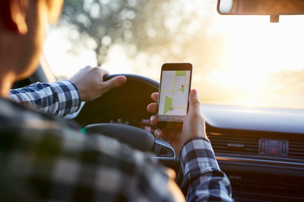 Man looking at navigation app on phone