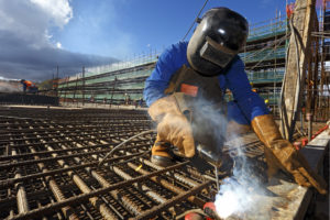 man welding rebars