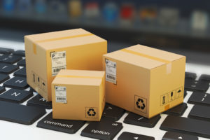 miniature packaged box on top of a laptop keyboard