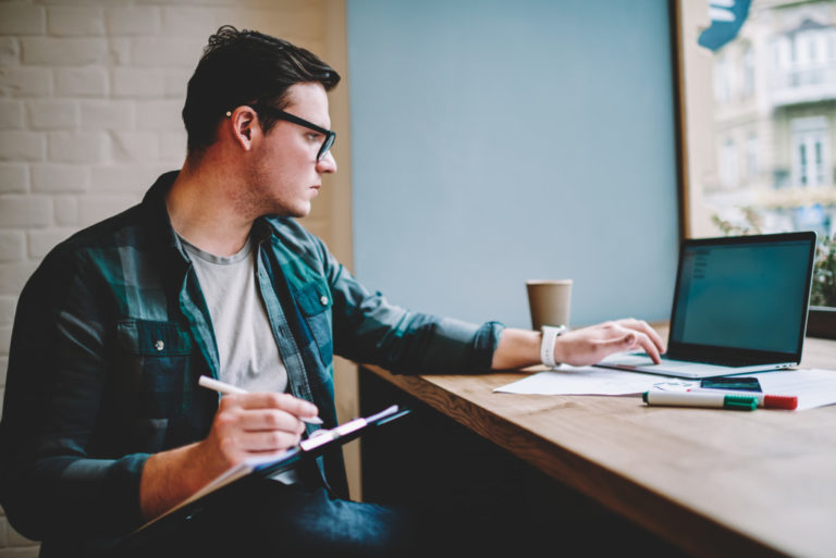 man studying in cafe