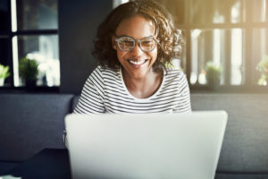 a person typing on their computer