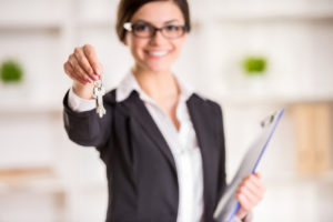 agent handing a house key