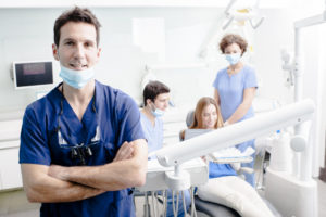 dentist with his team and patient