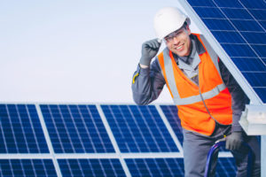 man installing solar panels