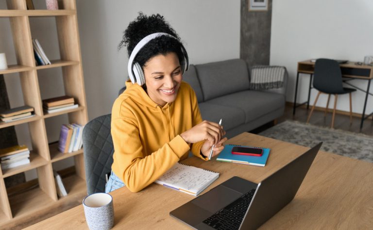 girl smiling on laptop