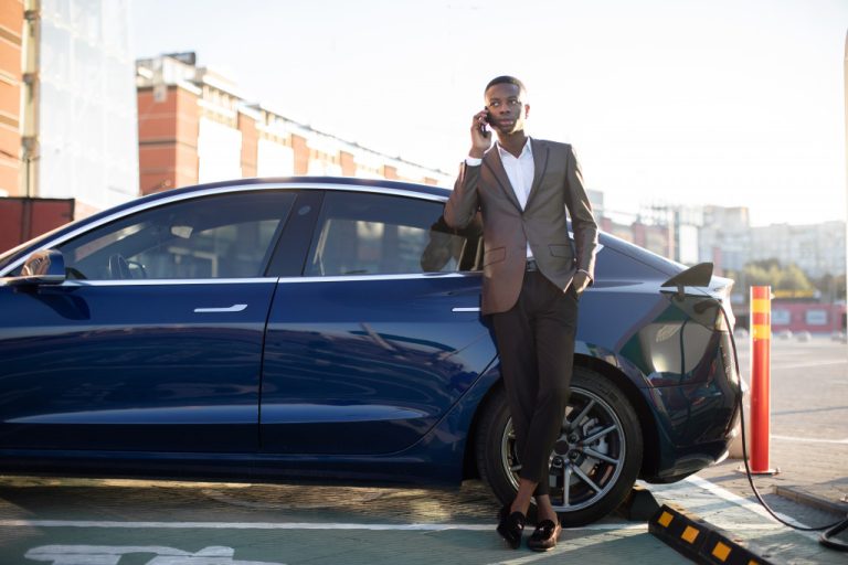 businessman charging his EV