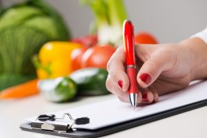 nutritionist writing medical records