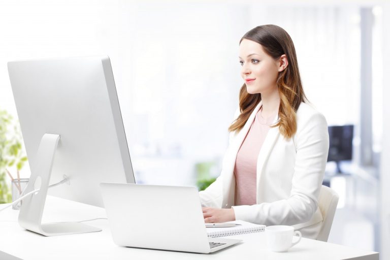 modern career woman in her white office