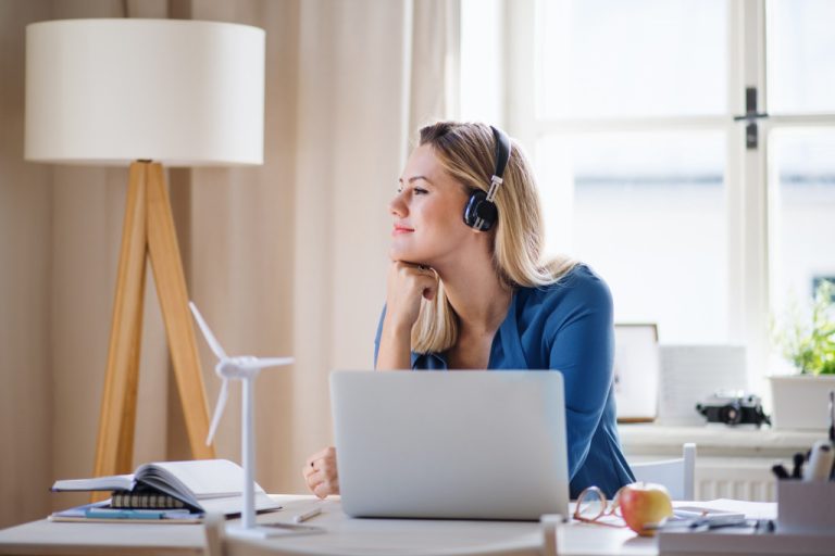 a smiling woman while working at home